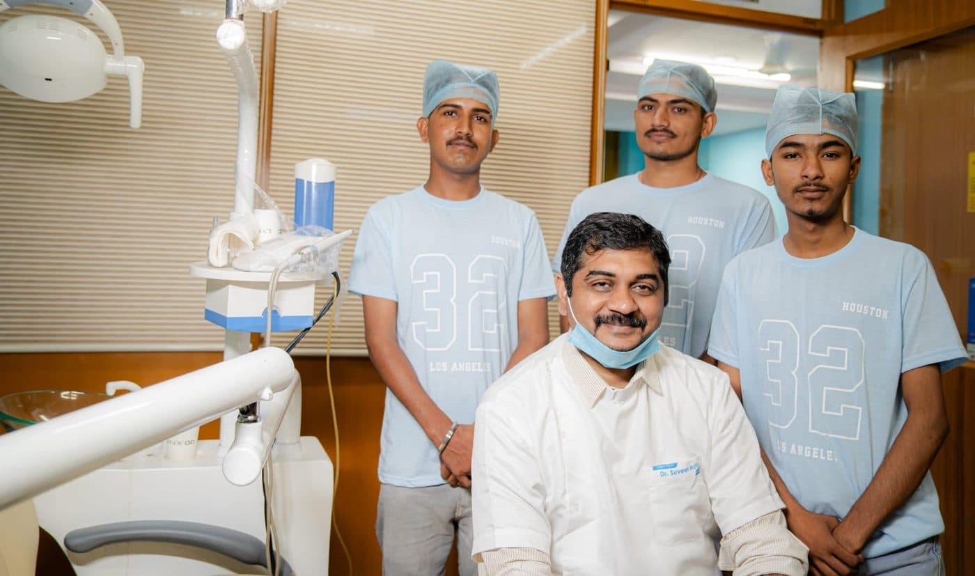 Dr Suveet Mathur with his surgical assistants in the treatment room
